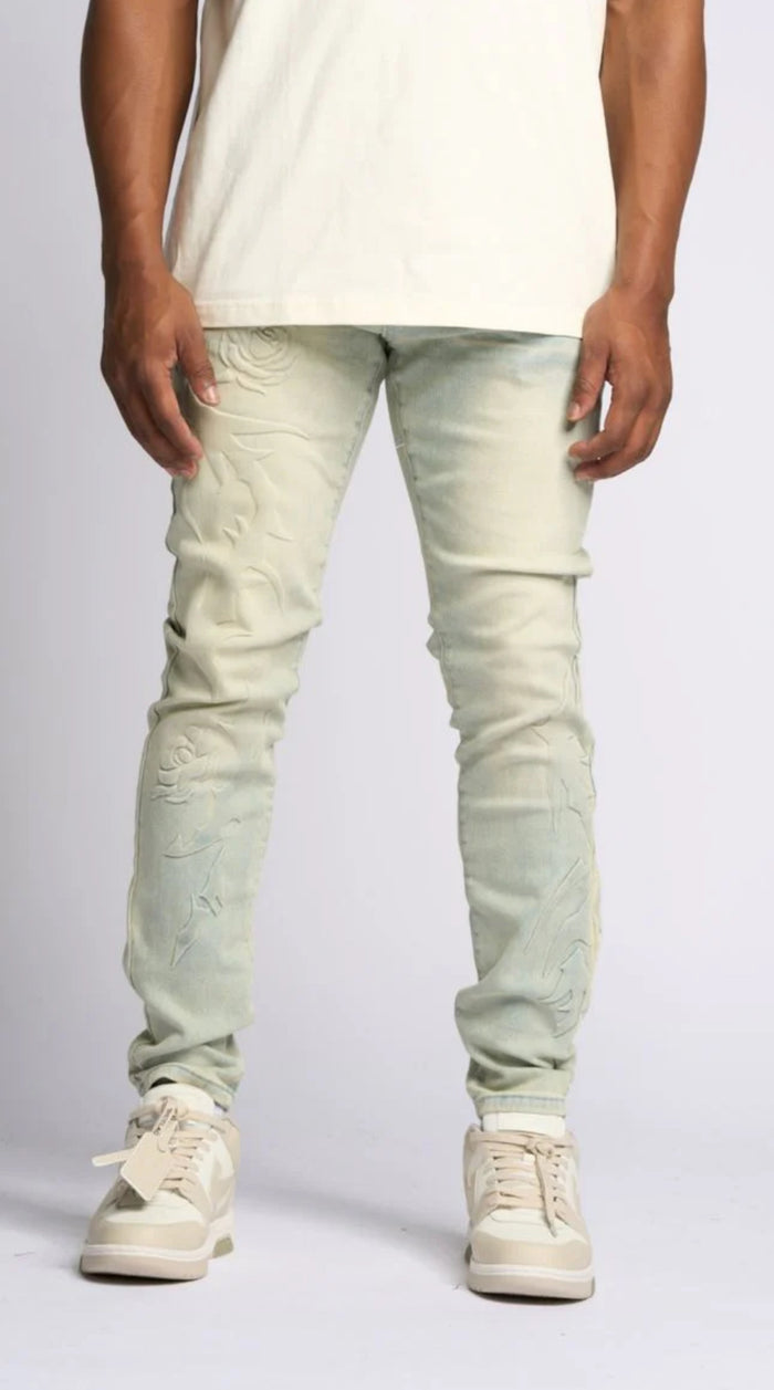 LOVE IS PAIN EMBOSSED SKINNY DENIM