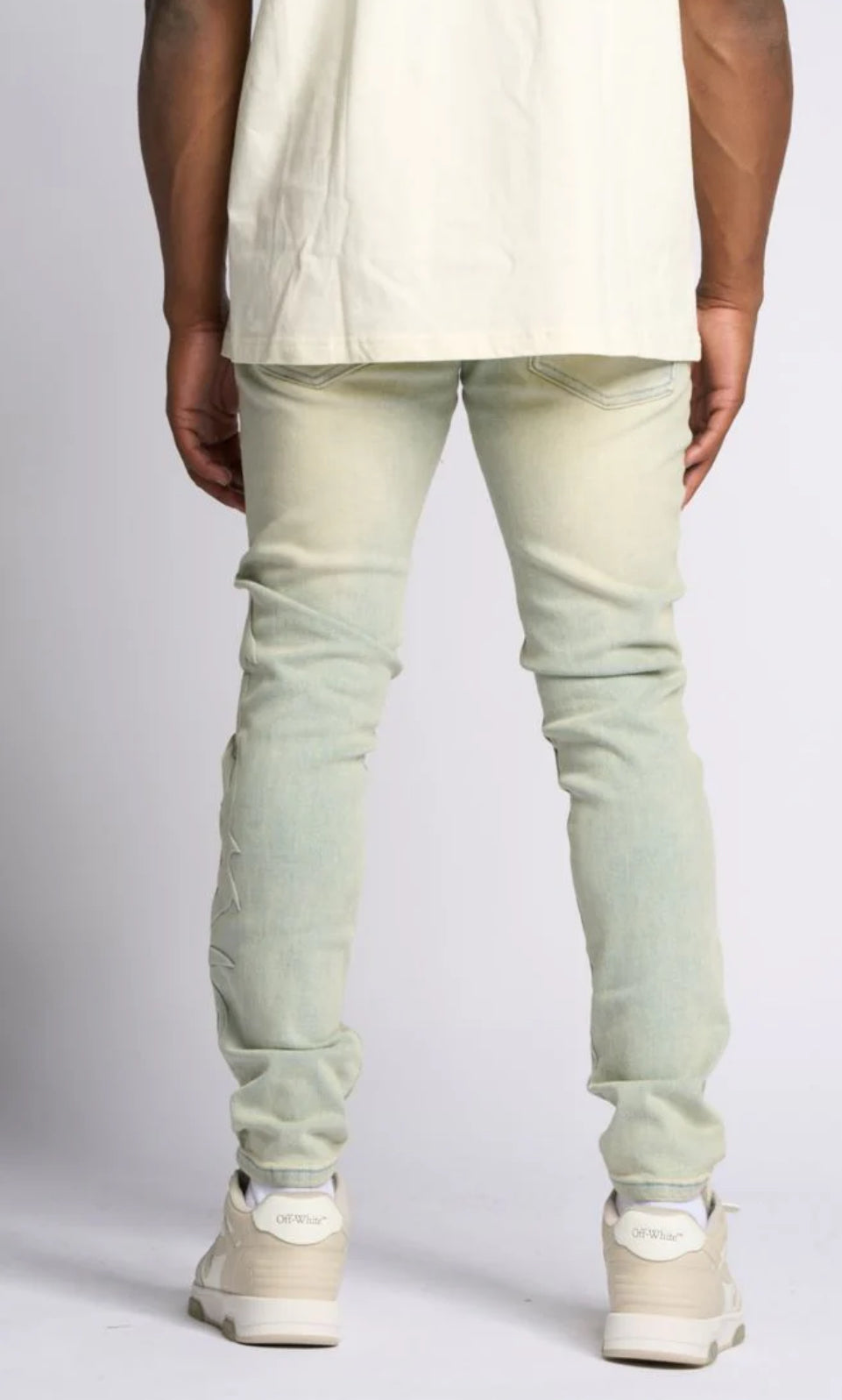 LOVE IS PAIN EMBOSSED SKINNY DENIM